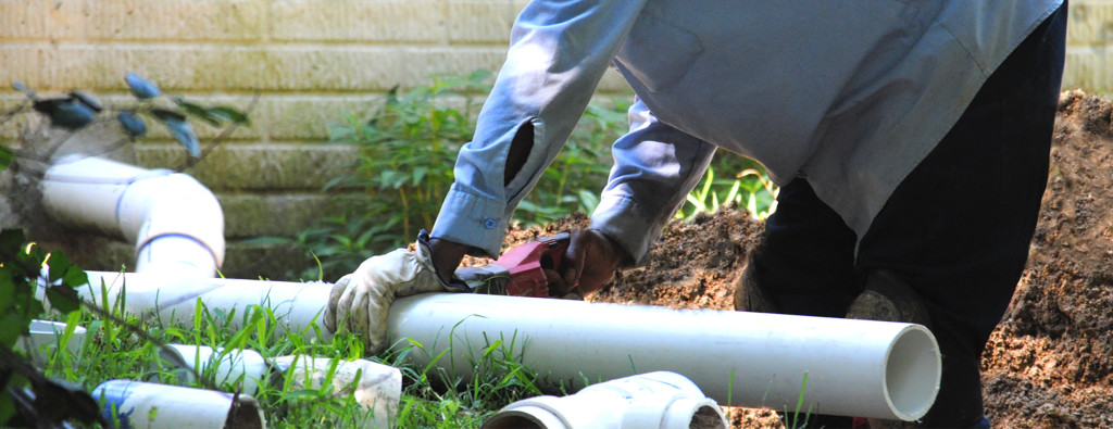 cutting a pvc sewer pipe